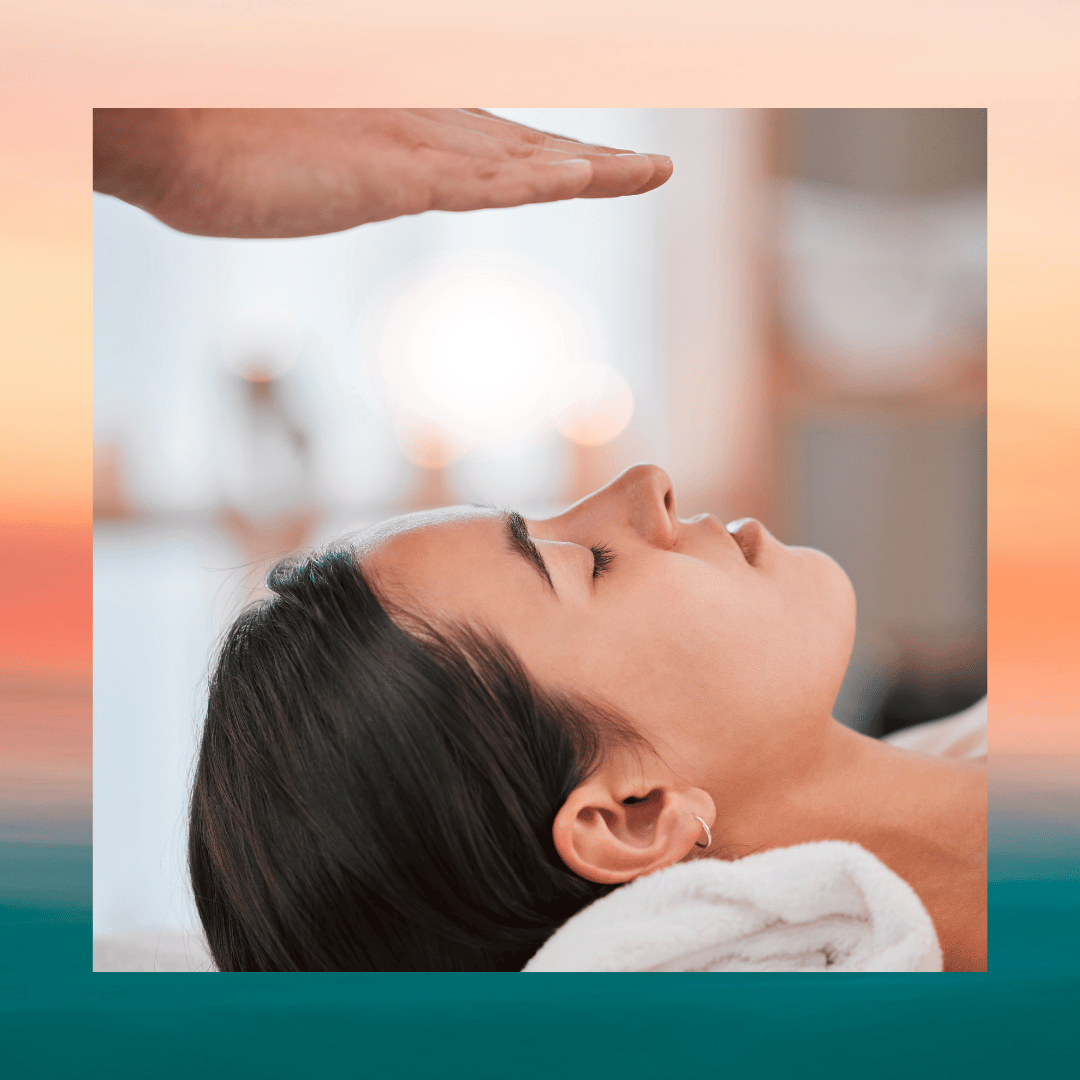 This is an image of a woman laying with her head on a pillow and hands hovering above.